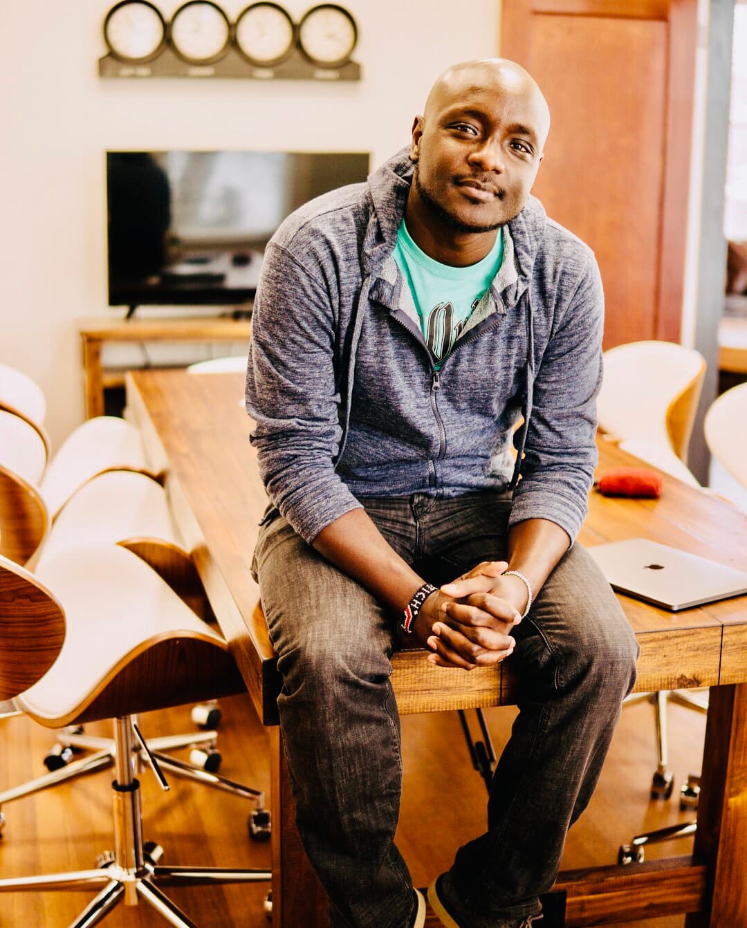 Peter Rotich seated in a workspace